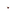 Gold heart shaped charm with maroon enamel coloring.
