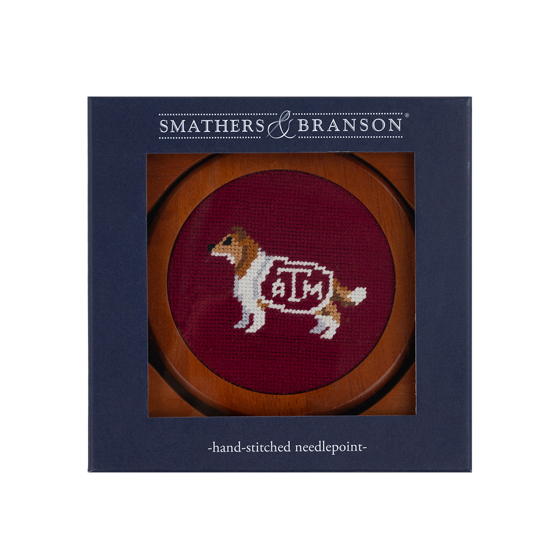 Hand-stitched needlepoint coasters with wooden edges and Texas A&M designs on each coaster
