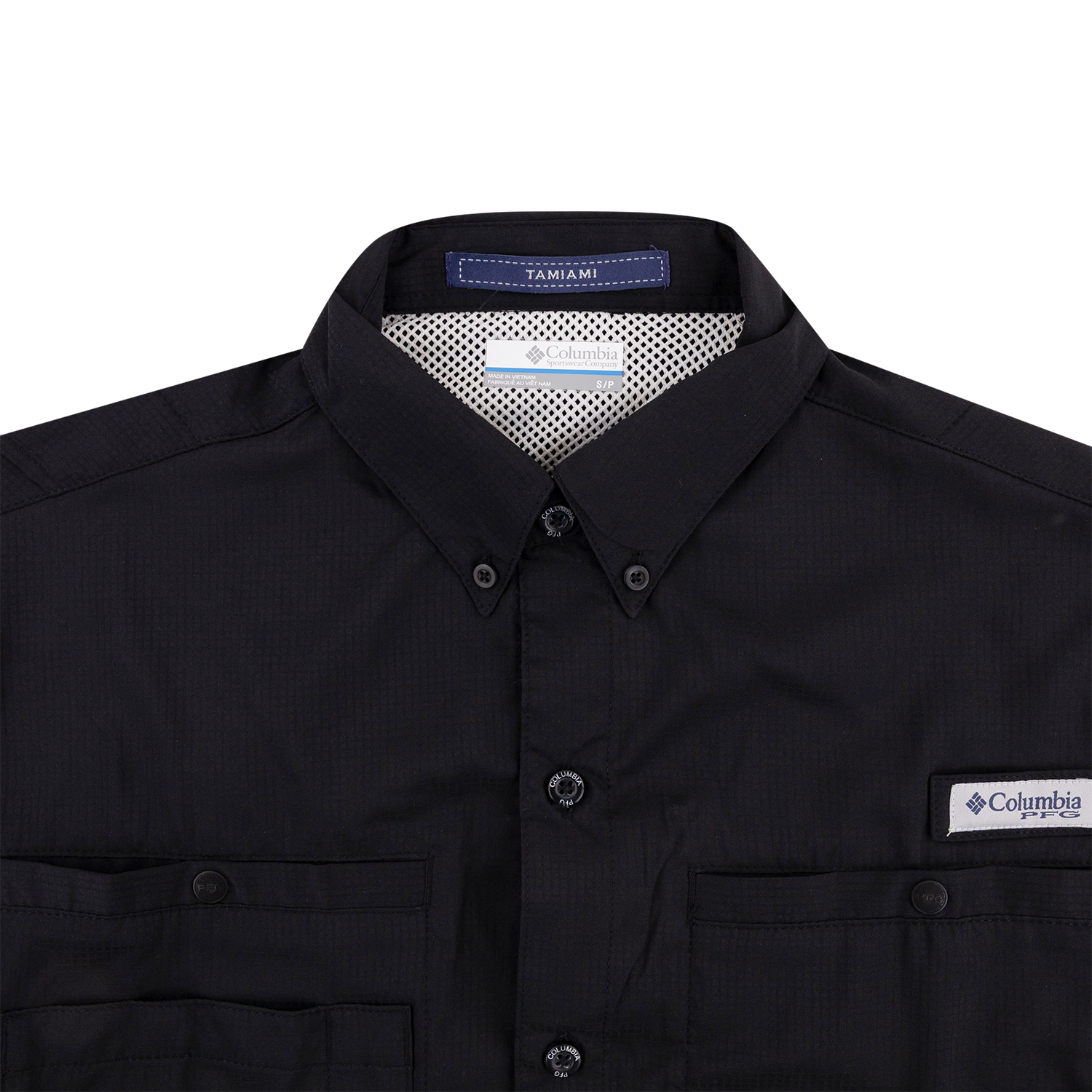 A close-up of a black Columbia Tamiami button-down shirt, showing the collar, front buttons, chest pockets, and the Columbia logo patch on the left chest.