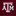 A close-up of a maroon textured fabric item featuring a large white embroidered Texas A&M 'A&M' logo.