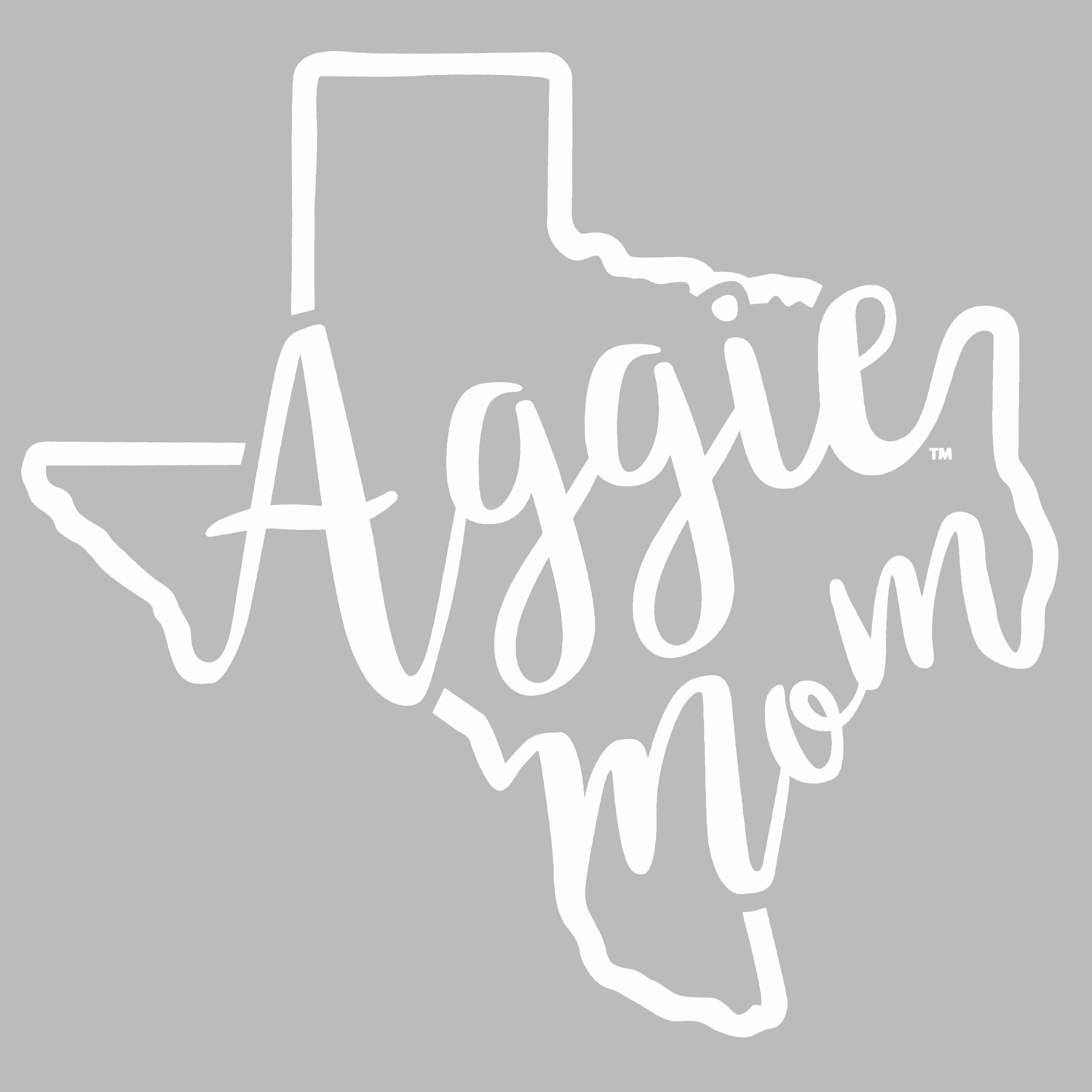 White vinyl decal sticker in the shape of Texas with the phrase 'Aggie mom' written in a cursive script, shown on a solid gray background.