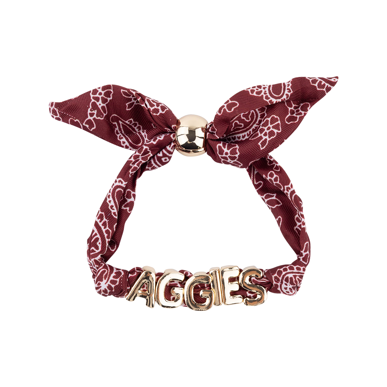 A bracelet in a deep maroon color with a white paisley pattern, featuring a metallic gold ball clasp at the top and the word 'AGGIES' spelled out in 3D gold letters at the bottom, shown on a plain white background.