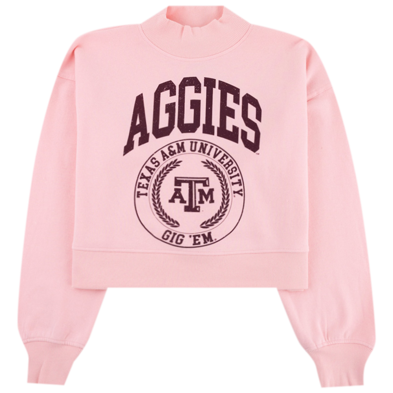 A light pink cropped sweatshirt featuring maroon text reading "AGGIES" arched above a circular Texas A&M University seal with the "ATM" logo and "GIG 'EM" printed on the front.   