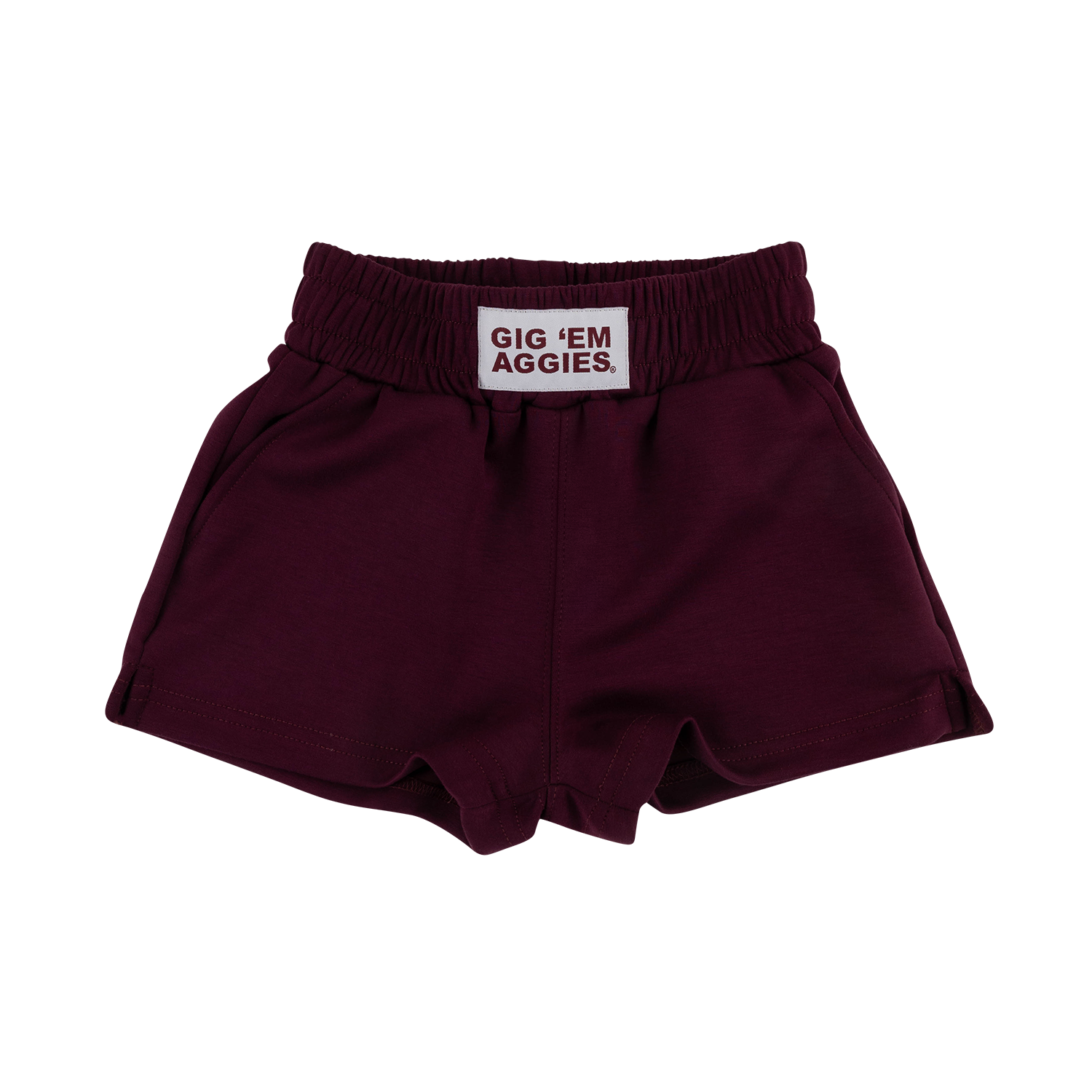 A pair of youth girls maroon shorts with an elastic waistband and a white brand label that reads 'GIG 'EM AGGIES.' on a plain white background.