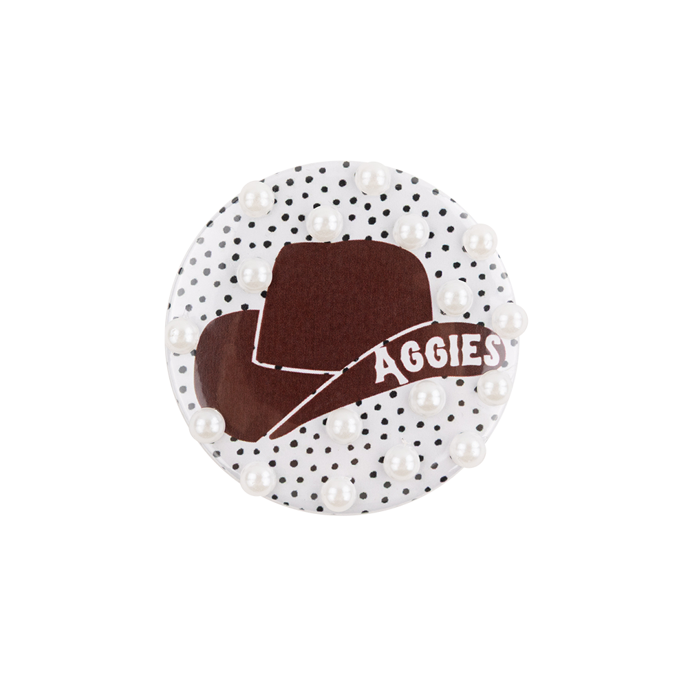 White button with maroon aggies hat and pearls