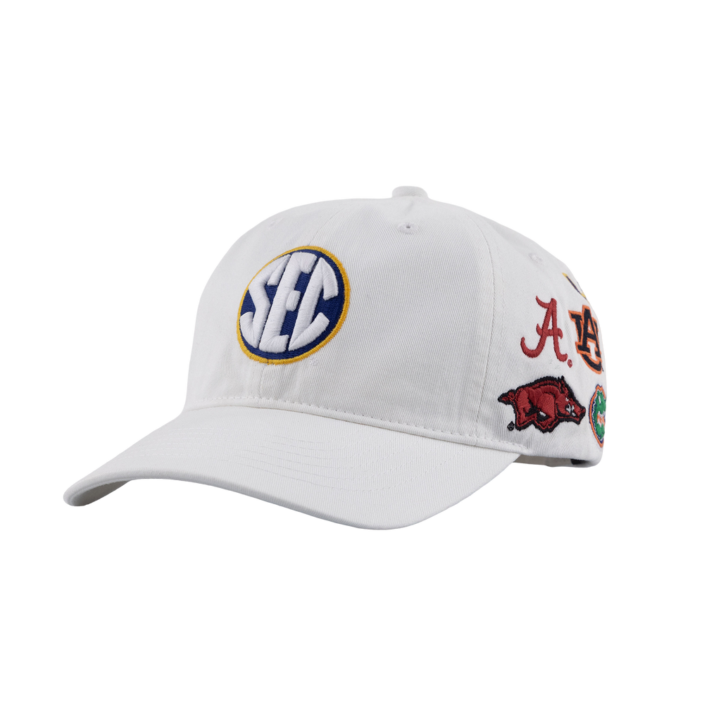 White adjustable baseball cap featuring a blue, white, and gold circular patch on the front and multiple colorful collegiate-style patches along the side.