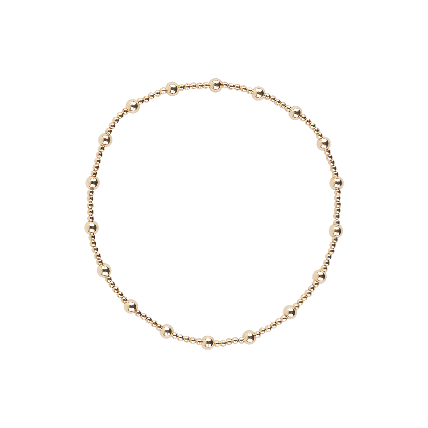 A delicate gold beaded anklet with varying bead sizes arranged in a circle on a plain white background.