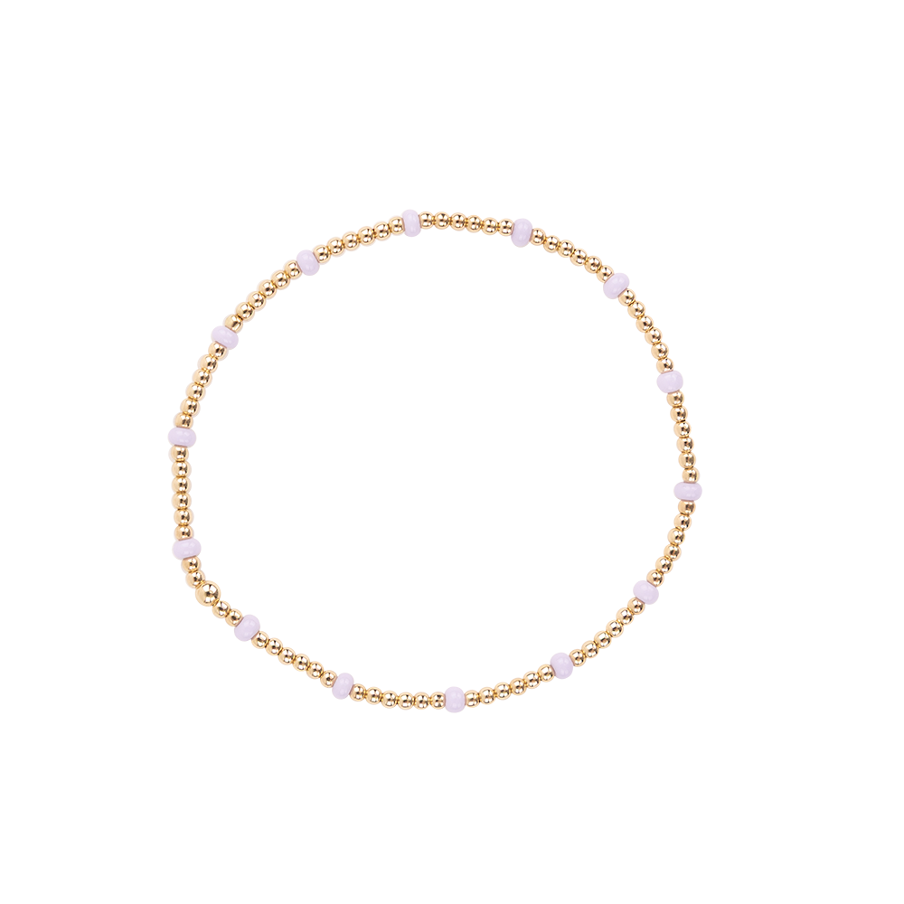 Gold beaded bracelet with gold and lilac beads 