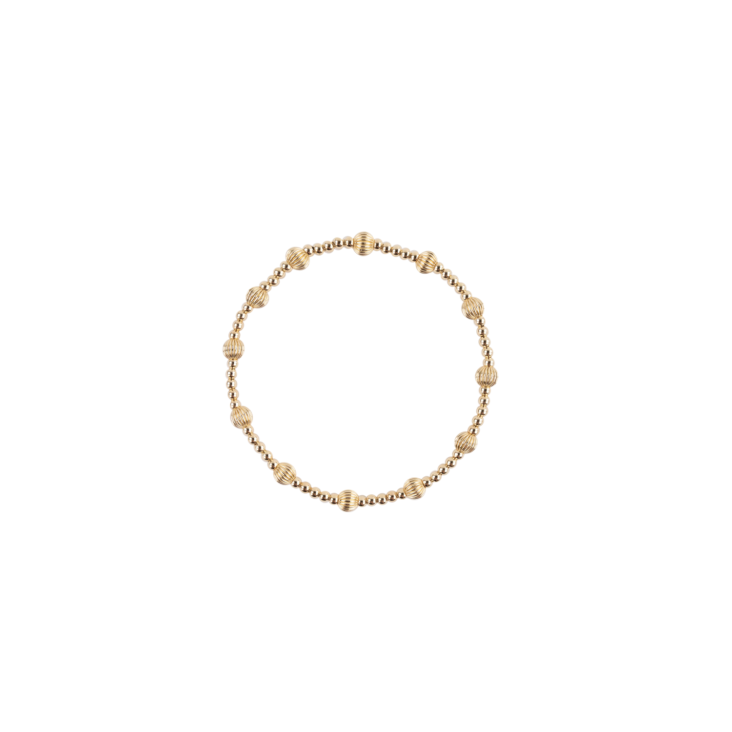 A delicate gold beaded bracelet with small textured spacer beads, arranged in a circle on a solid white background.