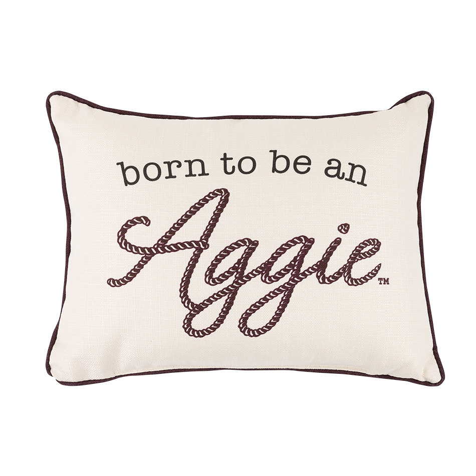Cream pillow with "born to be an Aggie" in black and maroon rope design
