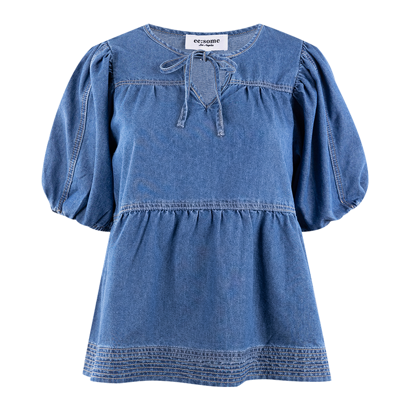 Denim top with a tie in the front and puff sleeves. 