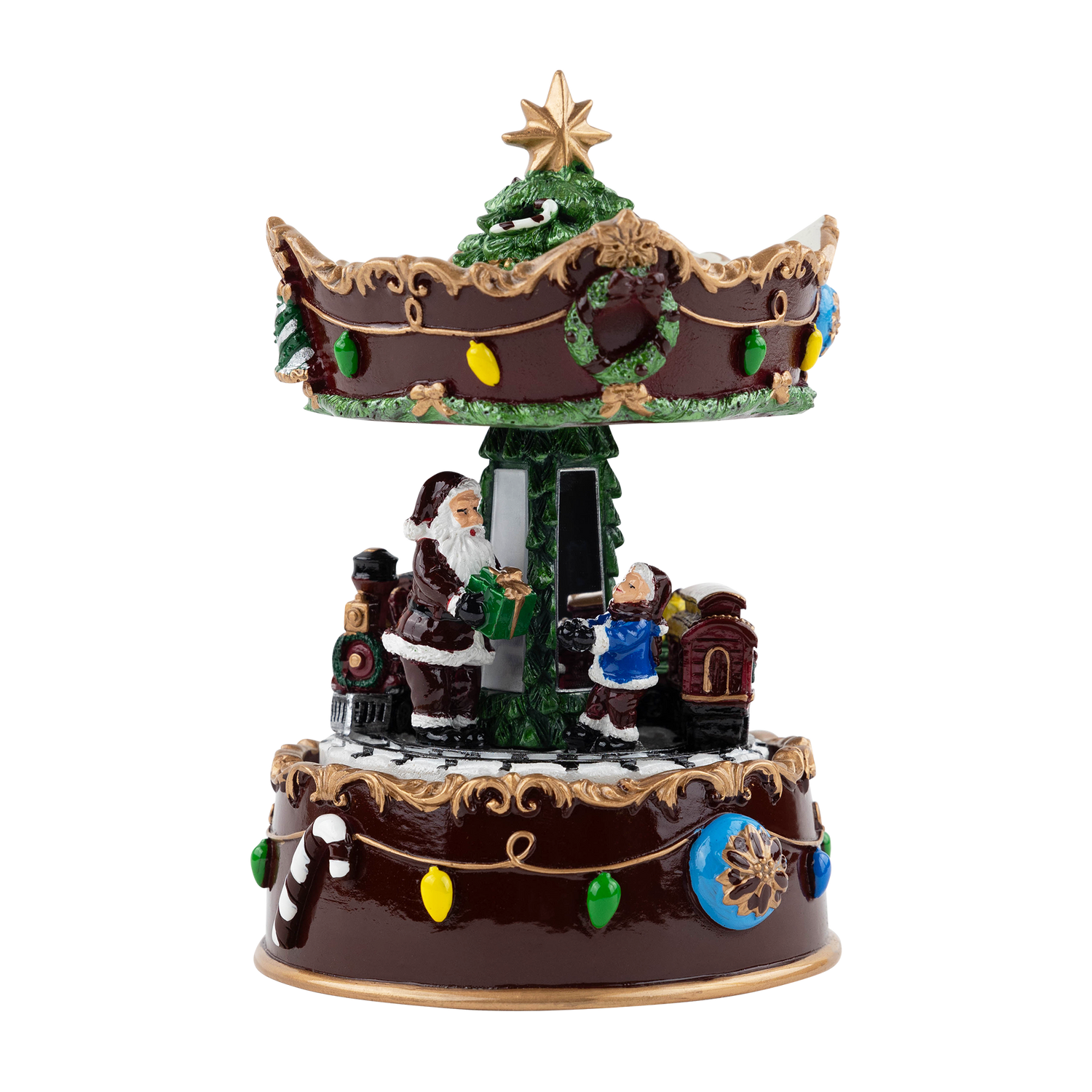 Decorative Christmas musical figurine featuring Santa and a child beside a Christmas tree, surrounded by a miniature train and a two-tier brown carousel-style design with colorful holiday lights, wreaths, and a gold star topper.