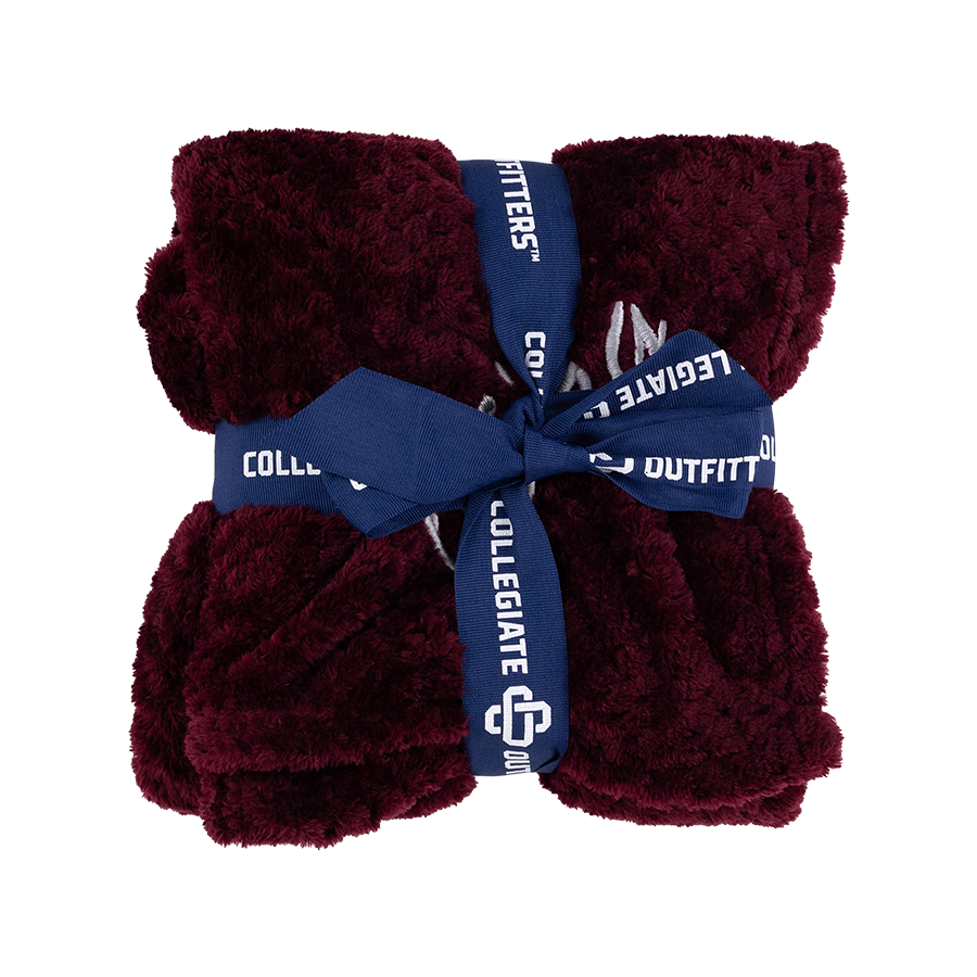Maroon fleece blanket with a blue ribbon.