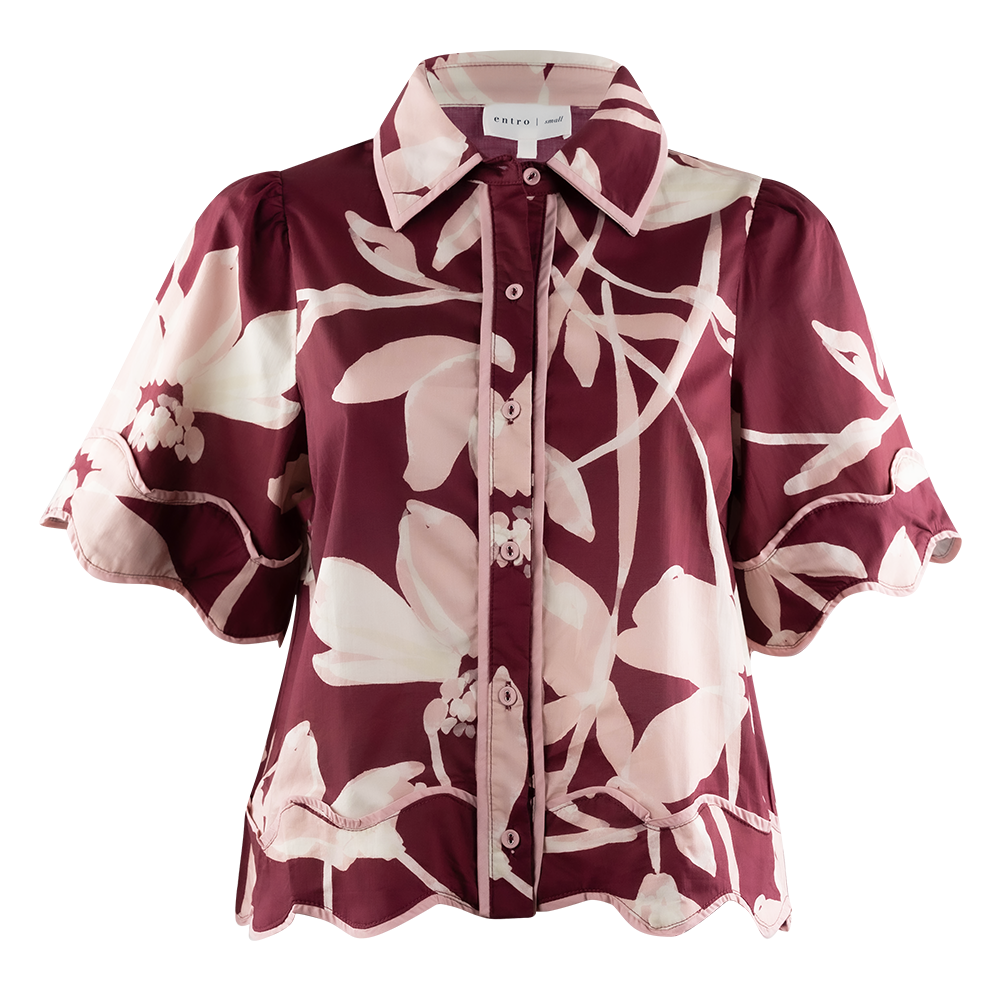 A short-sleeve button-up blouse with a burgundy and cream floral print, featuring puff sleeves and a scalloped hem, shown against a plain white background.