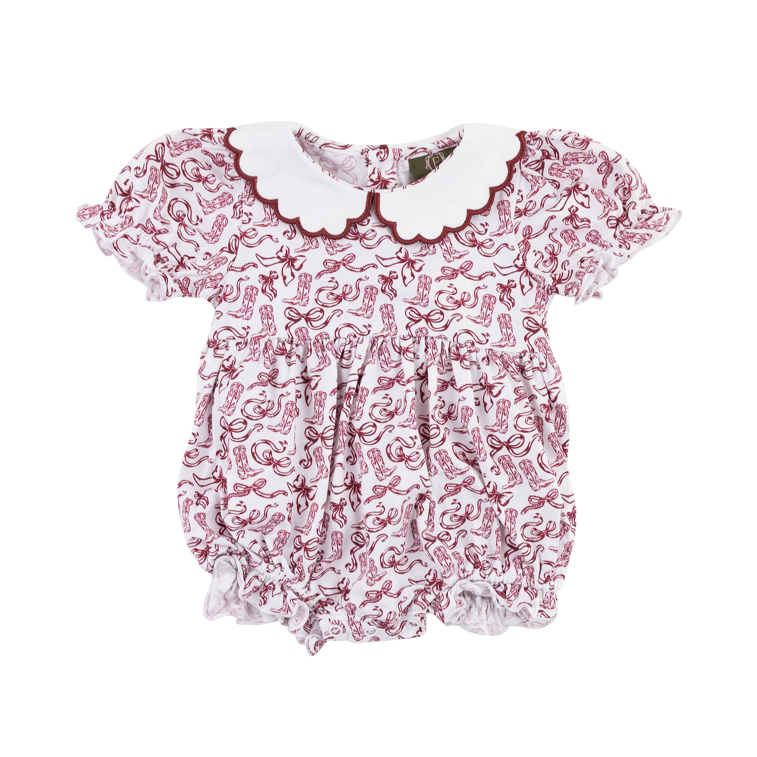 A baby girl’s white bubble romper featuring a burgundy Western-inspired print of cowboy boots, bows, and decorative swirls. It has a large white scalloped Peter Pan collar trimmed in burgundy, short ruffled puff sleeves, a gathered waist, and elasticized leg openings with ruffle detailing.