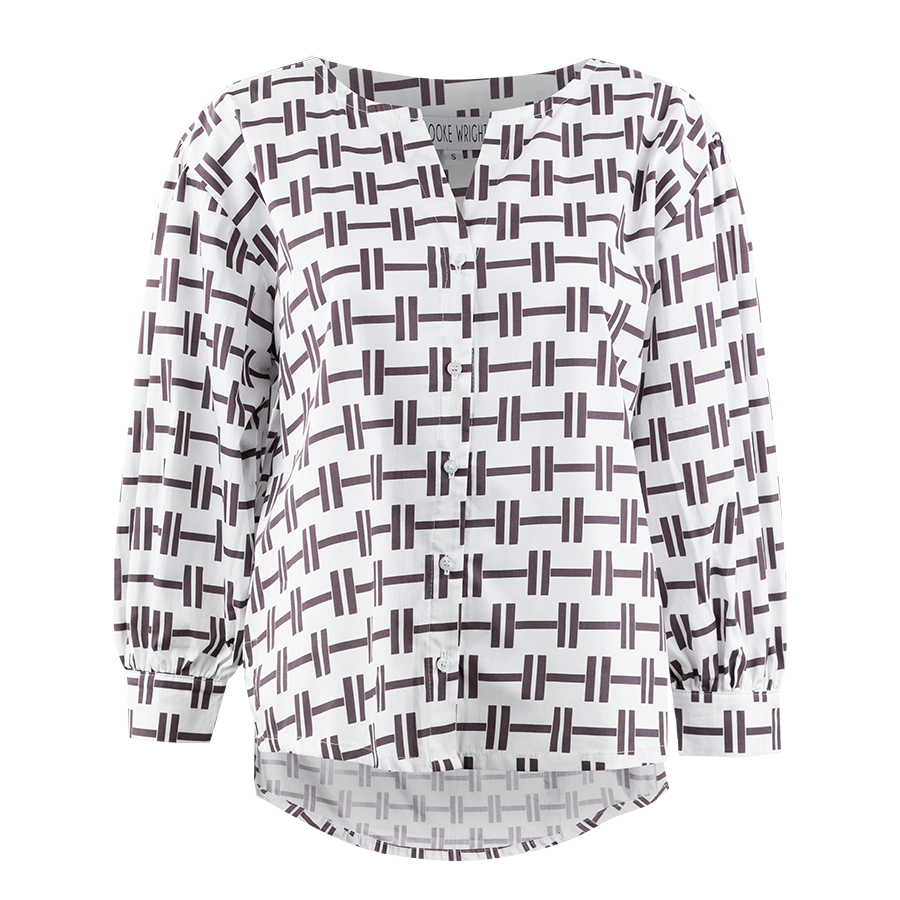 White blouse with maroon design.