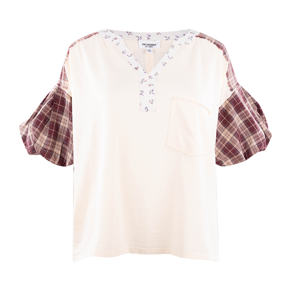 Cream top with a plaid design on the sleeves and a v line cut neck with a soft flower design.