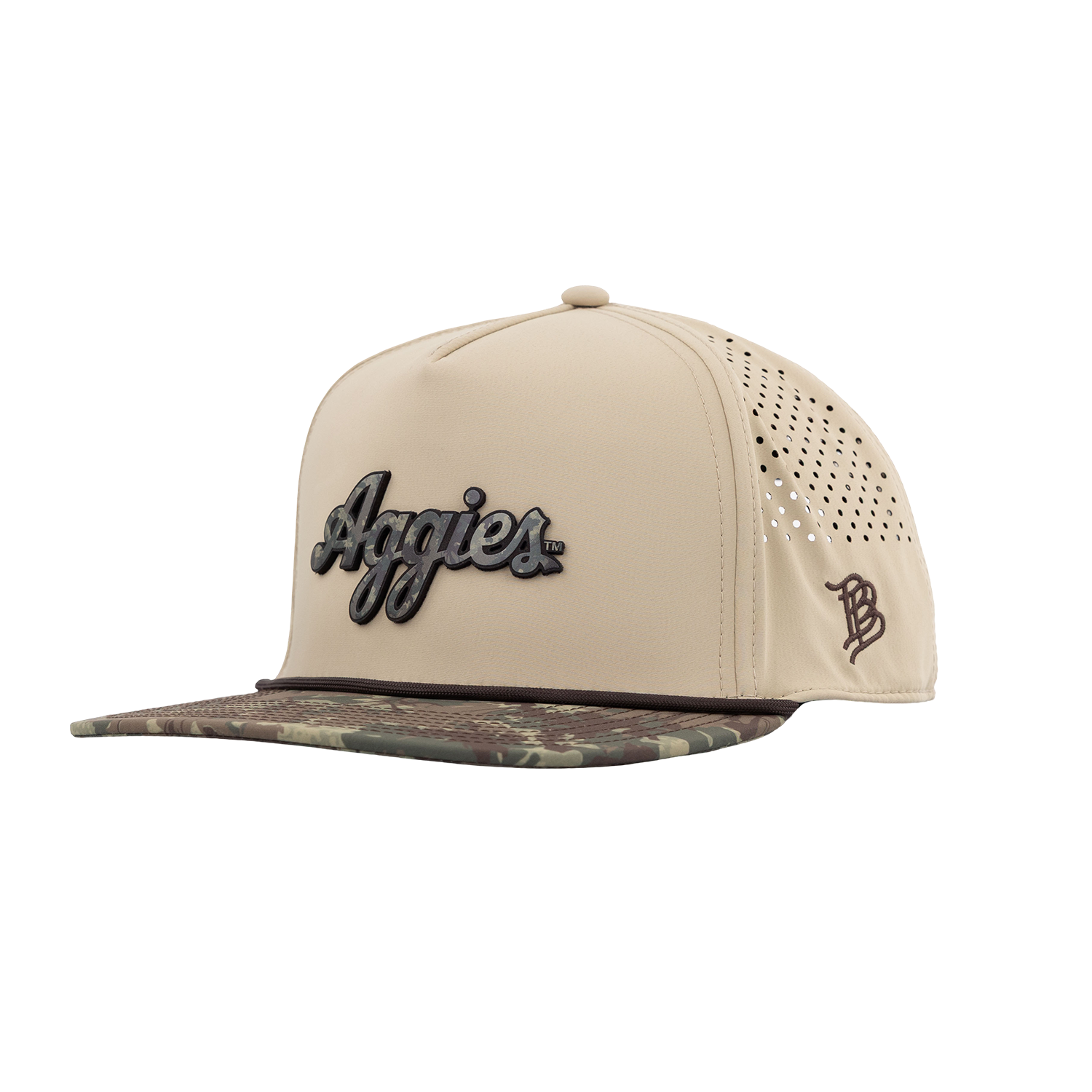 A beige snapback cap with a camouflage-patterned visor, featuring a black and gray 'Aggies' script logo on the front and a brown monogram logo on the side.