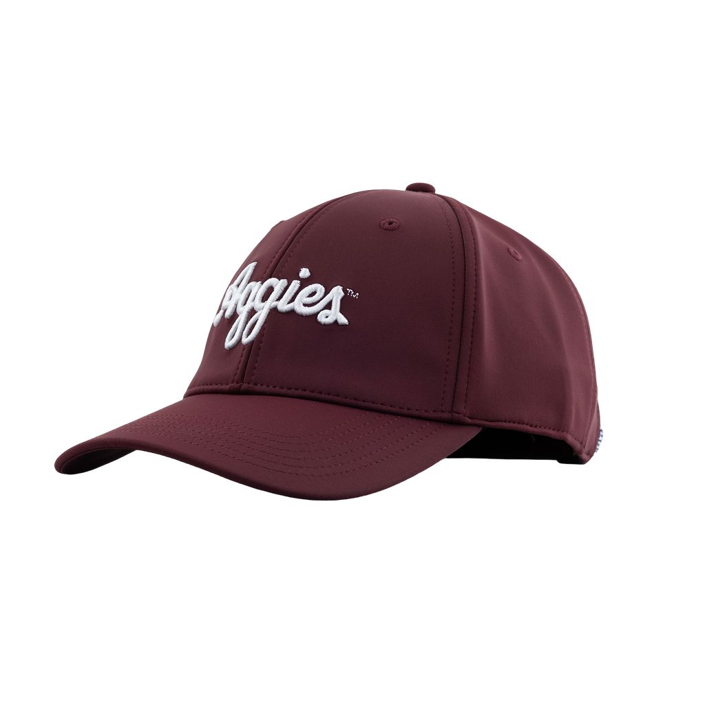 Maroon baseball cap with white script 'Aggies' embroidery on the front against a plain white background. 