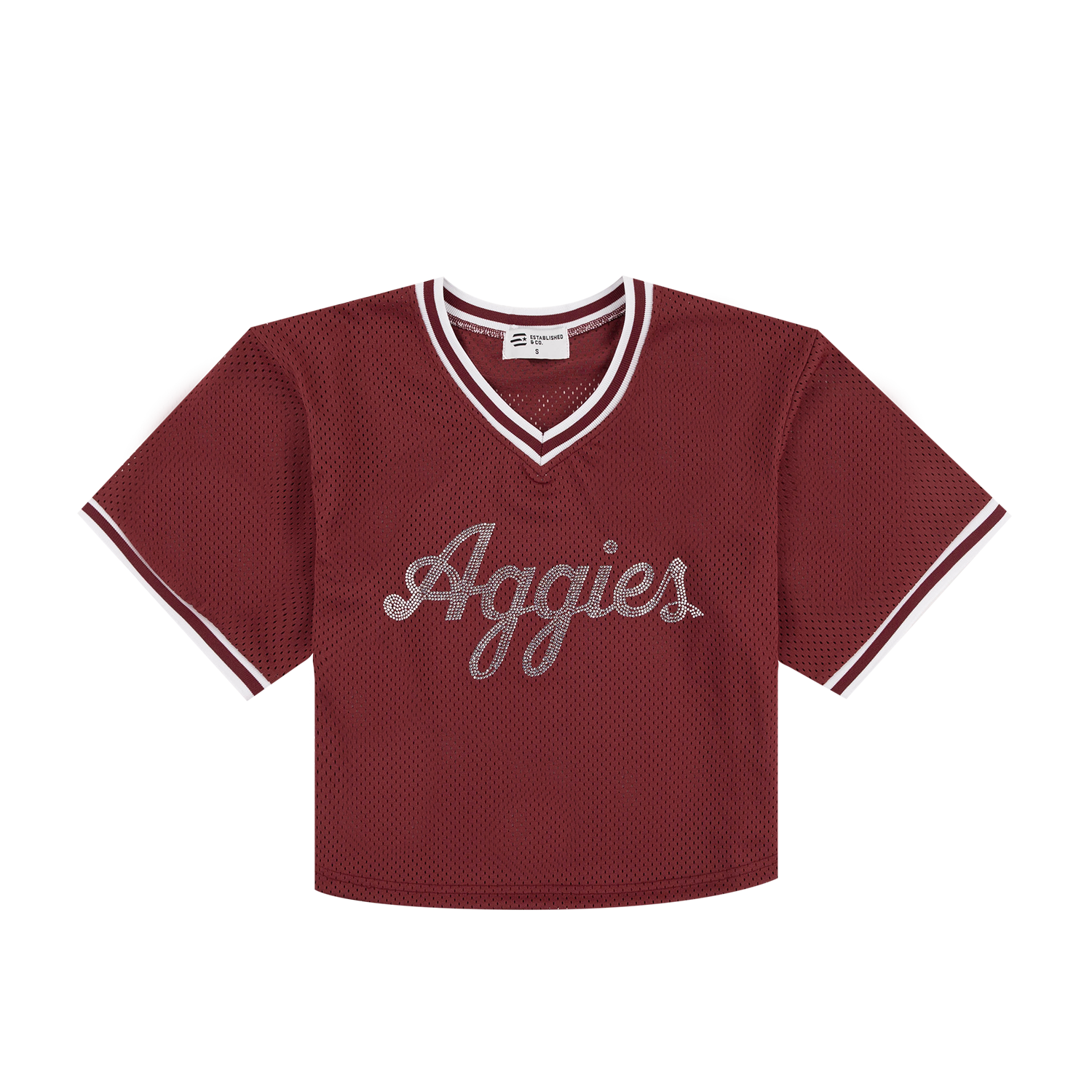 A cropped short-sleeve V-neck jersey top in maroon mesh with white trim on the collar and sleeve cuffs, featuring 'Aggies' in white script across the chest.