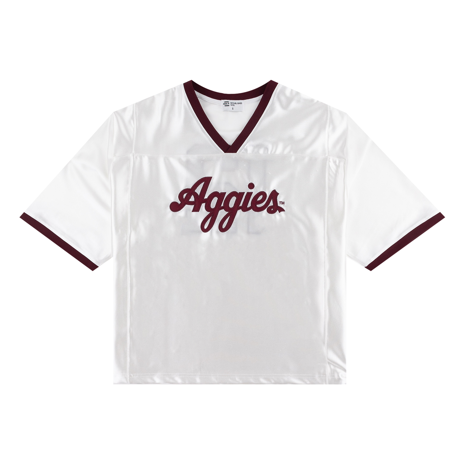 A white short-sleeve athletic jersey with dark maroon trim on the V-neck collar, sleeve cuffs, and 'Aggies' script lettering across the chest.