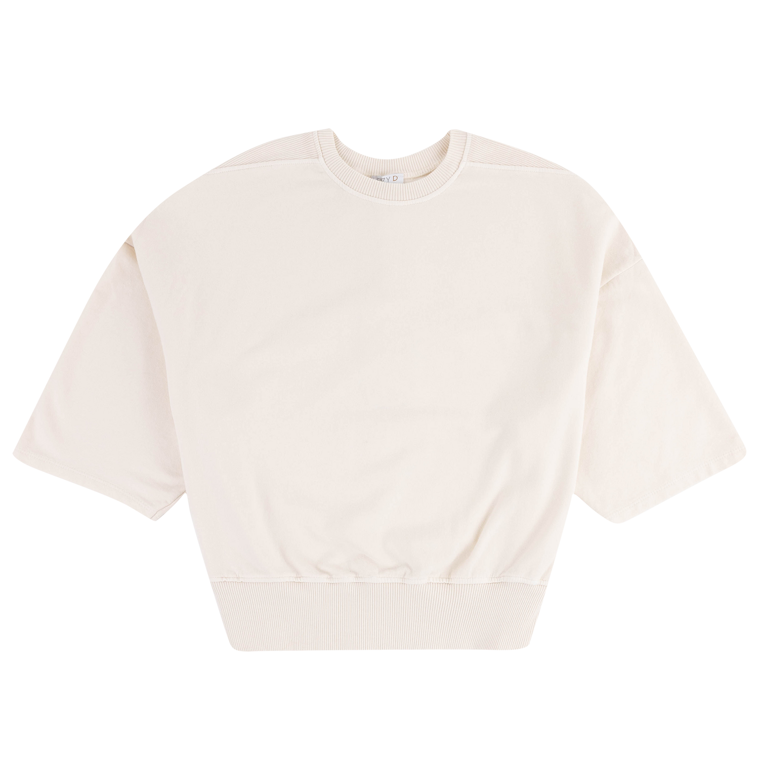 An oversized short-sleeve crewneck sweatshirt in a warm off-white or cream color, laid flat against a solid white background.
