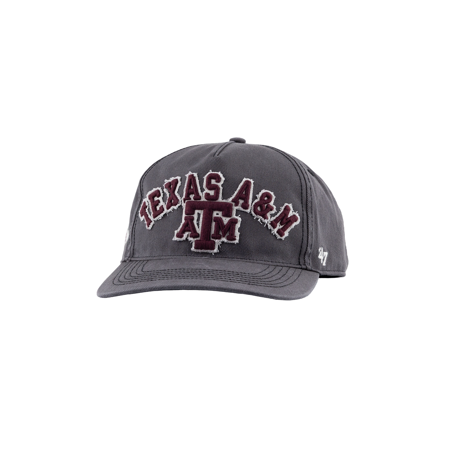 A dark gray baseball cap featuring 'TEXAS A&M' and the 'A&M' logo embroidered on the front in maroon with a white outline. The side of the cap displays a small white '47' logo.