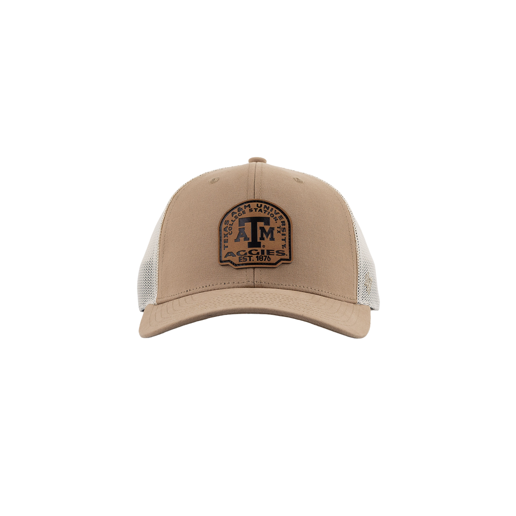 A beige trucker-style cap with a brown embroidered front patch featuring a large 'ATM' and the words 'Texas A&M University', 'College Station, TX, 'Aggies'