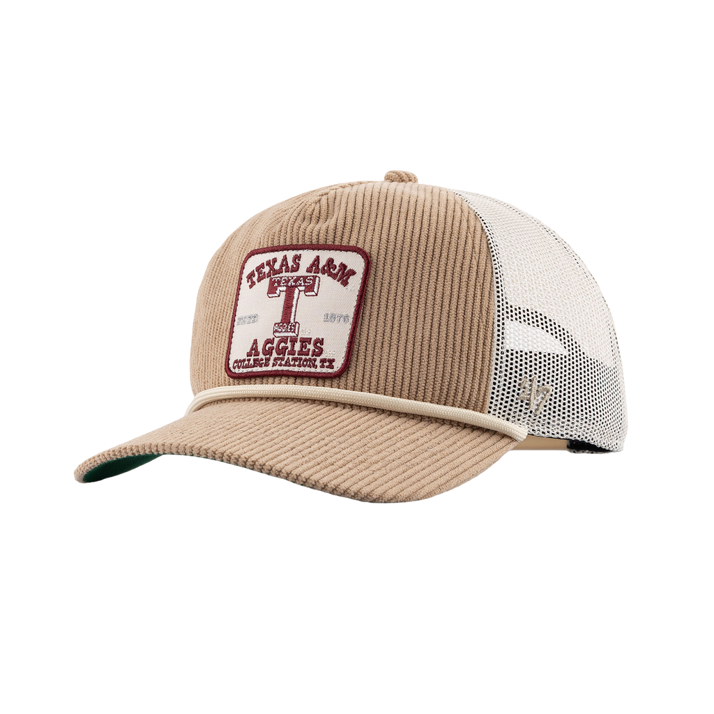 A tan corduroy trucker hat with a white mesh back and a front patch reading 'Texas A&M Aggies'.