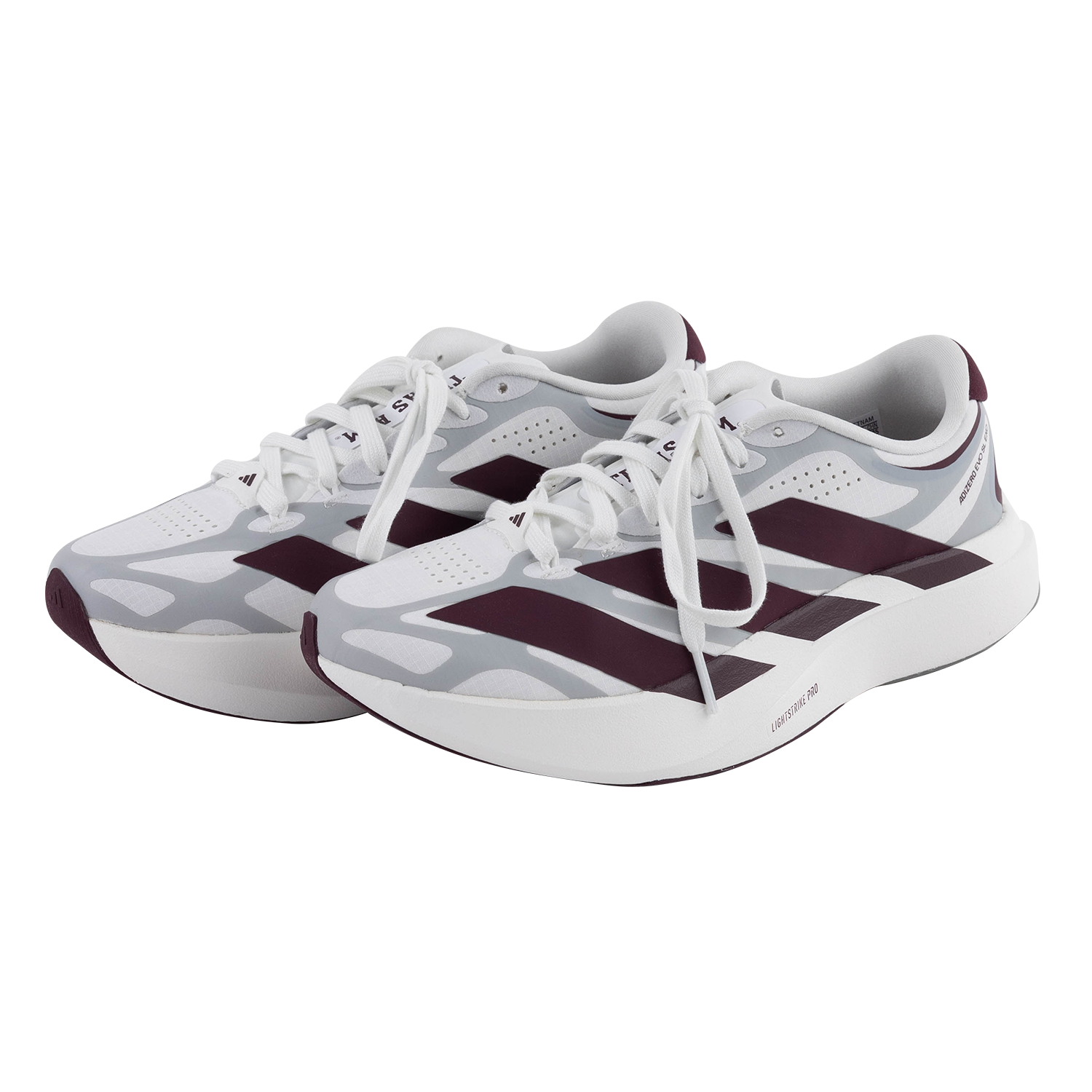 White tennis shoes with grey design and maroon three Adidas stripes. 