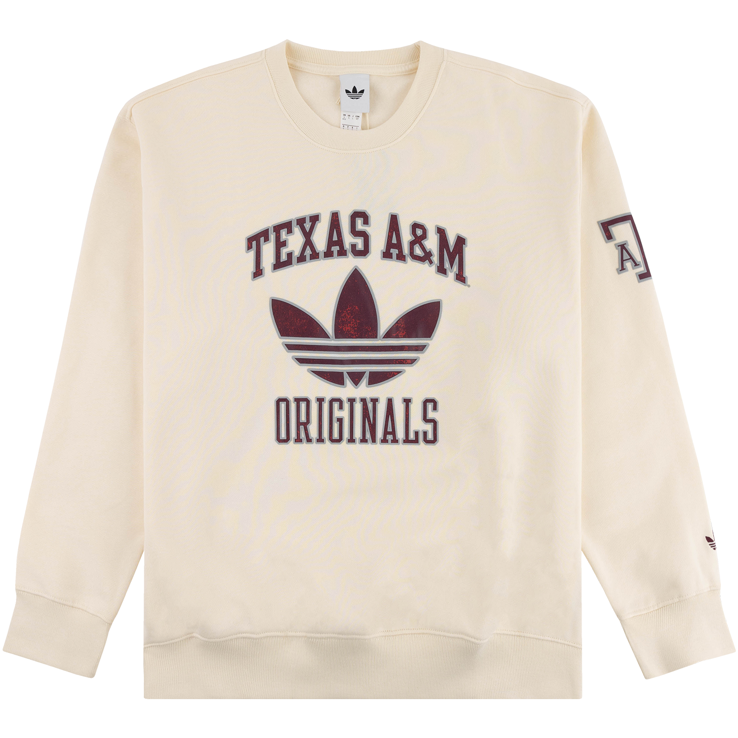 Cream-colored crewneck sweatshirt with an Adidas Originals logo and "TEXAS A&M" arched text above a maroon trefoil logo, with "ORIGINALS" printed below. The left sleeve features a partial "A&M" text graphic, and the small Adidas trefoil logo appears near the wrist.
