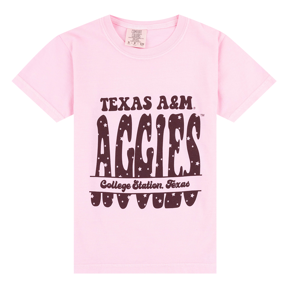 Pink shirt with maroon bubble lettering with tiny stars on the lettering.
