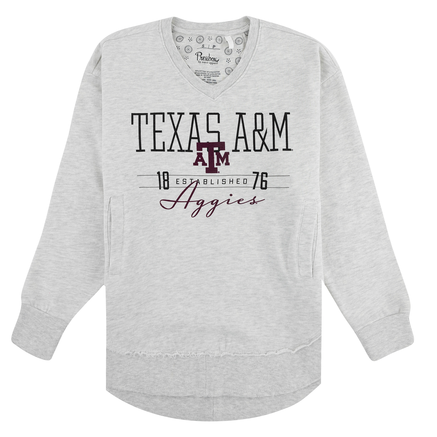 A heather gray long-sleeved tunic-style top with side pockets and a curved hem. The chest features maroon screen-printed graphics including “TEXAS A&M” in large text above a block "ATM" logo. Below the logo is “18 ESTABLISHED 76” and “Aggies” in cursive font. The inside neck has a Pressbox brand tag.