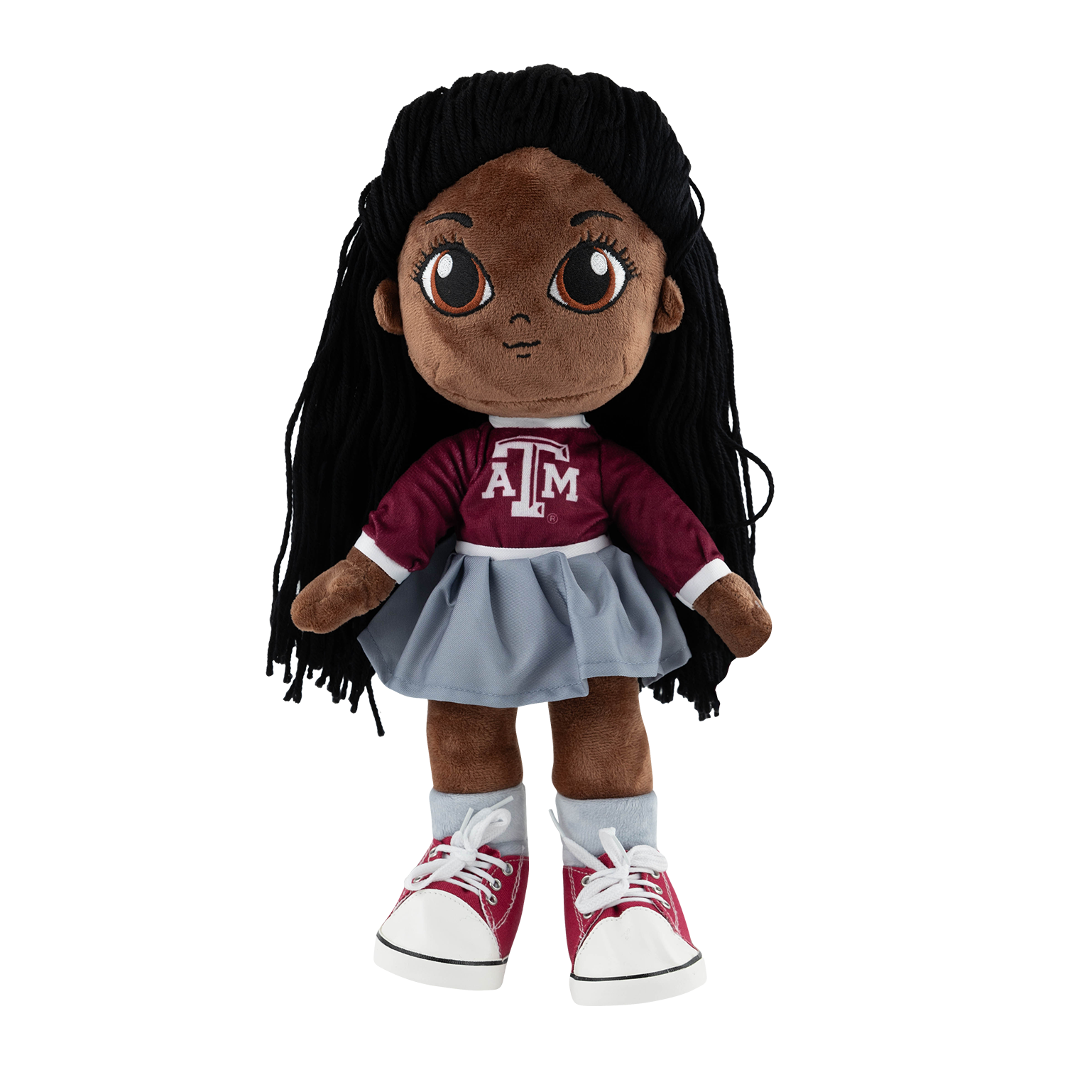 Plush doll wearing a maroon Texas A&M long-sleeve top with 'ATM' logo, gray skirt, gray socks, red and white sneakers, and long black yarn hair.