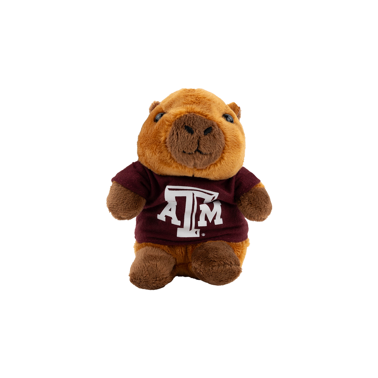Plush toy resembling a capybara wearing a maroon shirt with a logo on a white background