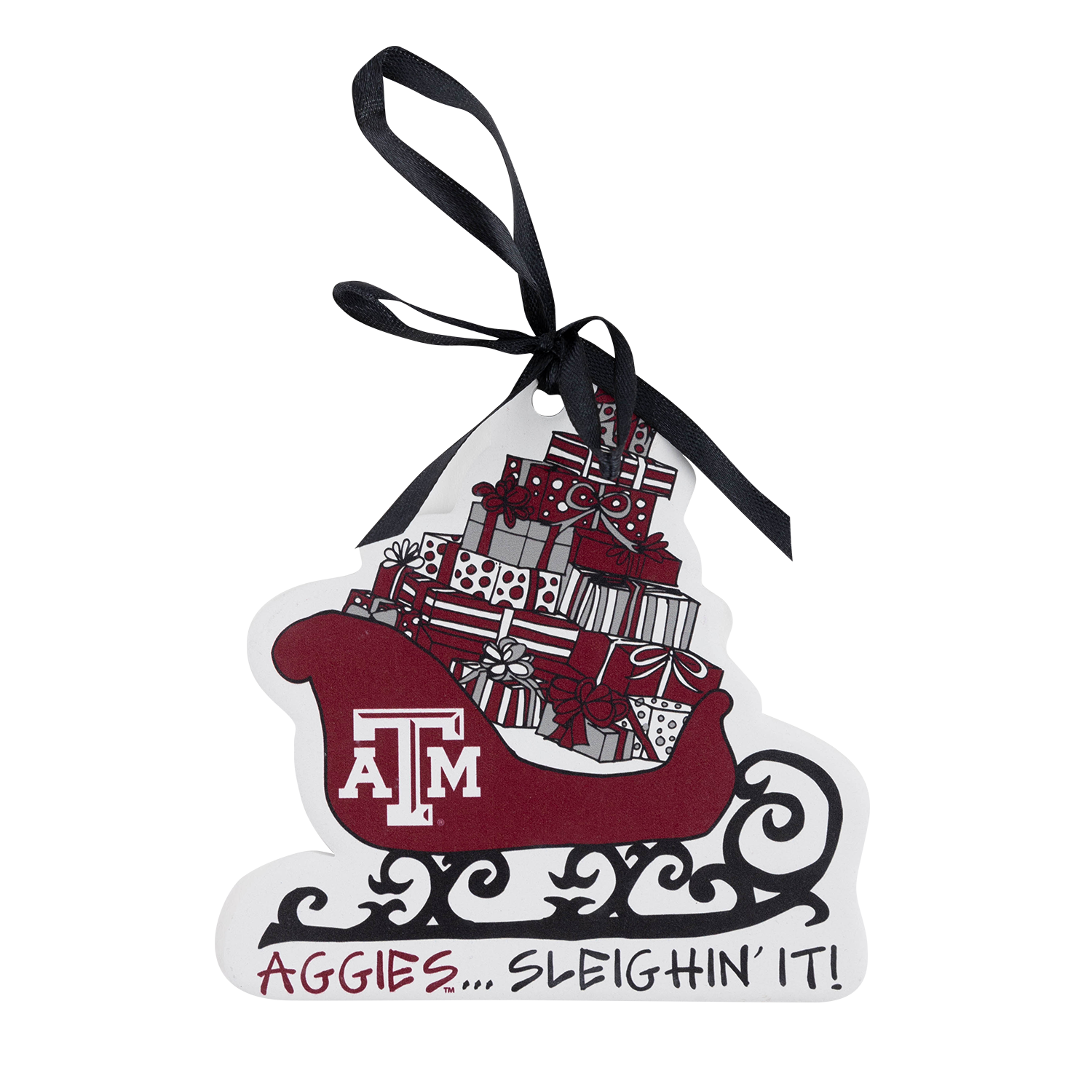 Christmas ornament featuring a maroon Texas A&M sled filled with wrapped presents, a Texas A&M logo, black decorative scrollwork, and the phrase “Aggies... Sleighin’ It!” A black ribbon hanger is attached at the top.