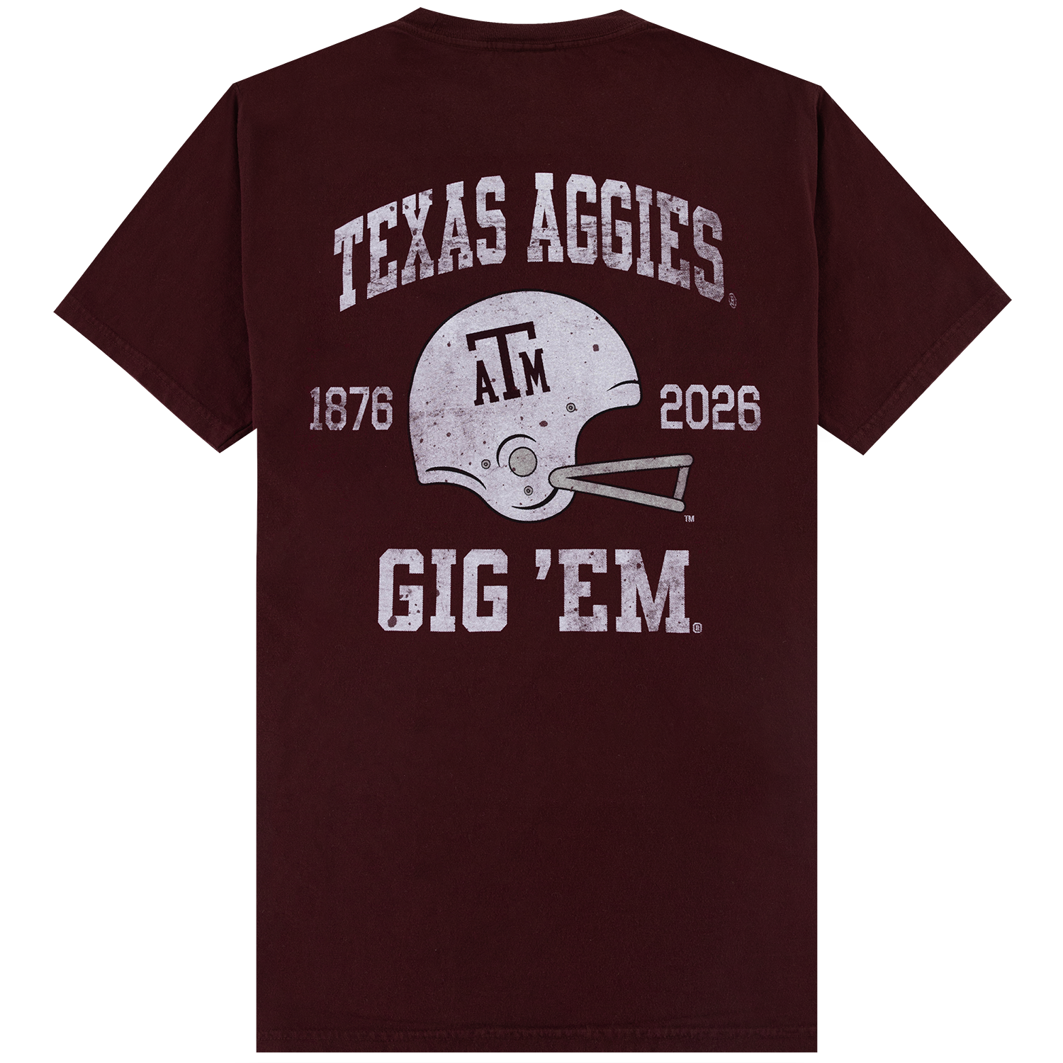 A maroon short-sleeve t-shirt shown from the back, featuring a distressed white graphic of a Texas A&M football helmet with 'TEXAS AGGIES' above and 'GIG 'EM' below, along with '1876' and '2026'.