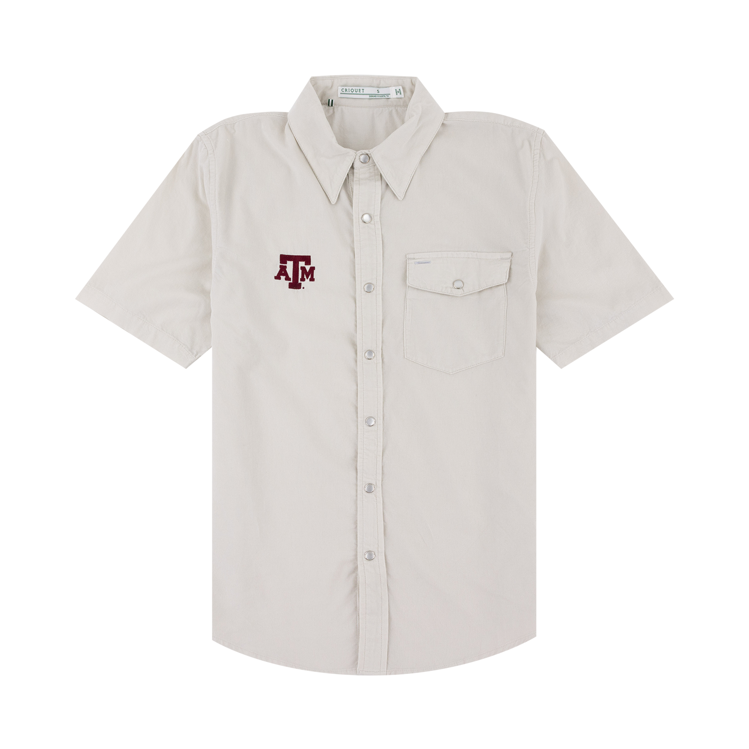 A short-sleeve button-up shirt in a light cream or off-white color, featuring a maroon embroidered 'A&M' logo on the left chest. The shirt has a pointed collar, a button-down front, and a single chest pocket with a snap button closure, shown against a plain white background.