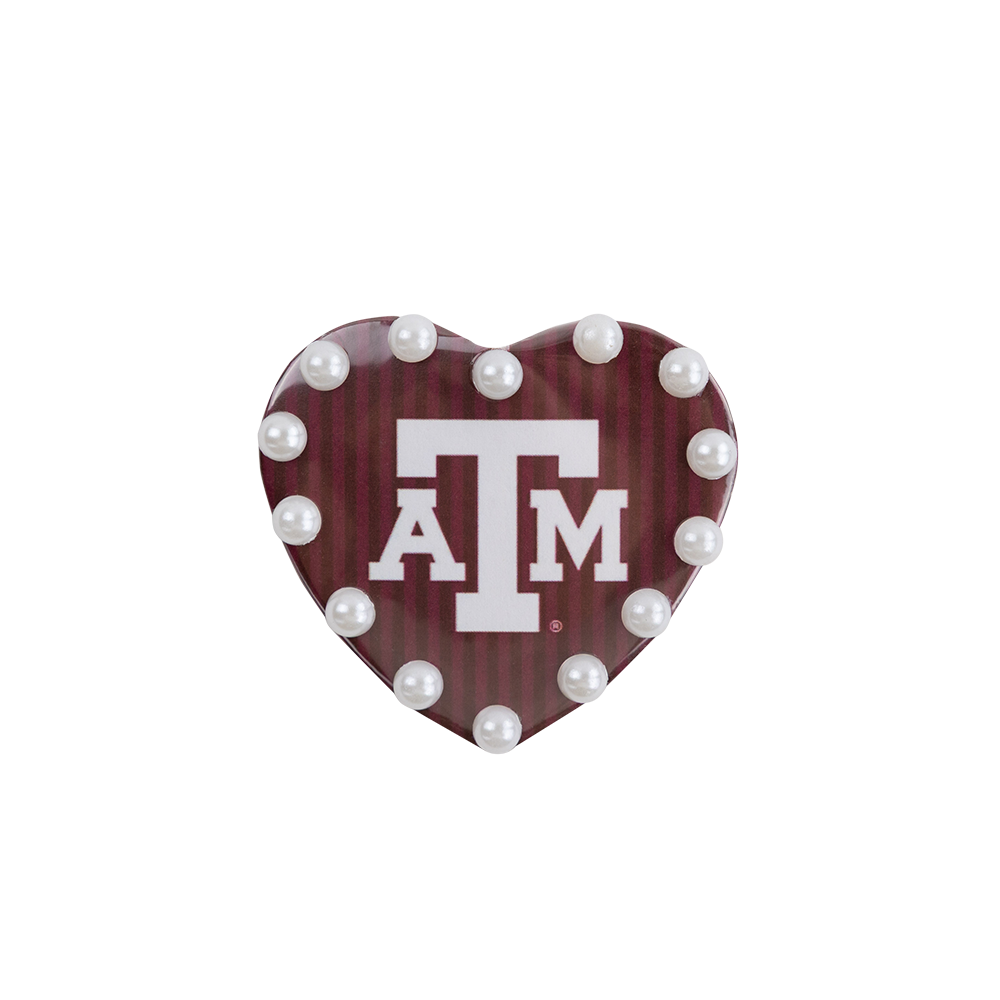 Heart-shaped maroon ornament with white 'ATM' logo and pearl-like beads 