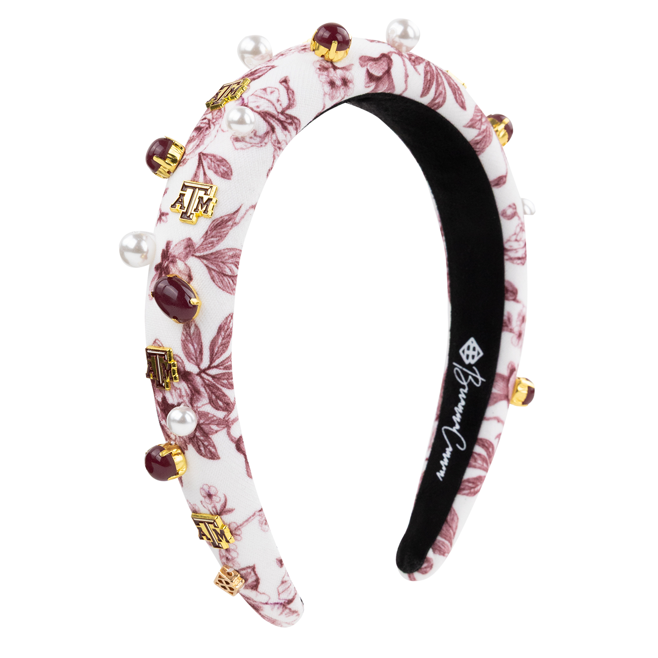 White headband with floral maroon designs with maroon studs and Texas A&M charms
