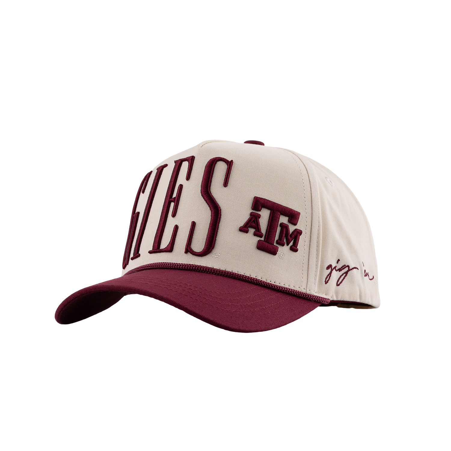 A baseball cap featuring a cream-colored crown with maroon embroidered lettering that reads 'AGGIES' and 'A&M', plus a small script logo on the side, set against a plain white background.