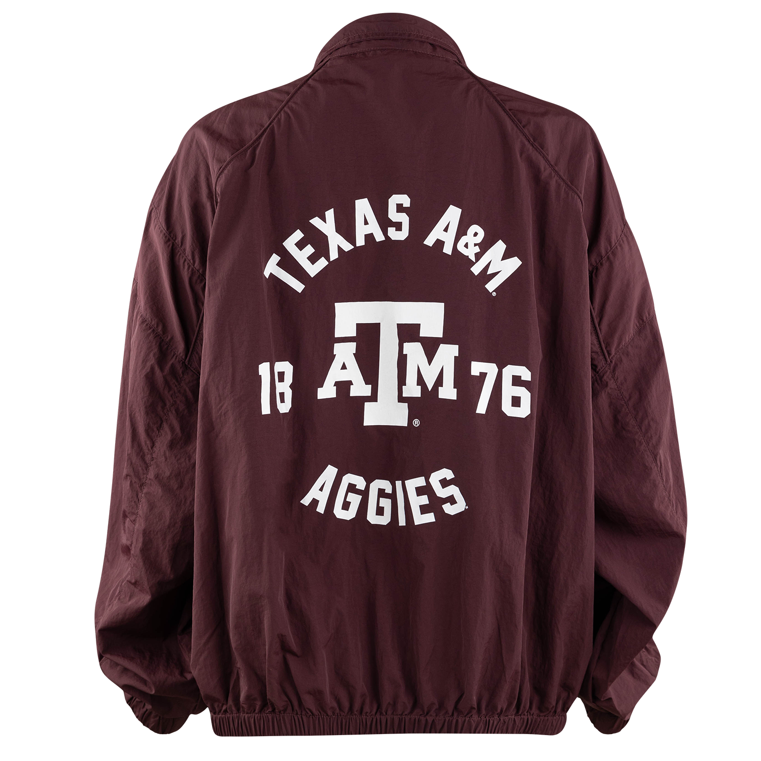 A maroon nylon coach jacket shown from the back, featuring a large white graphic print that reads 'TEXAS A&M 18 A&M 76 AGGIES' with the Texas A&M 'ATM' logo in the center.