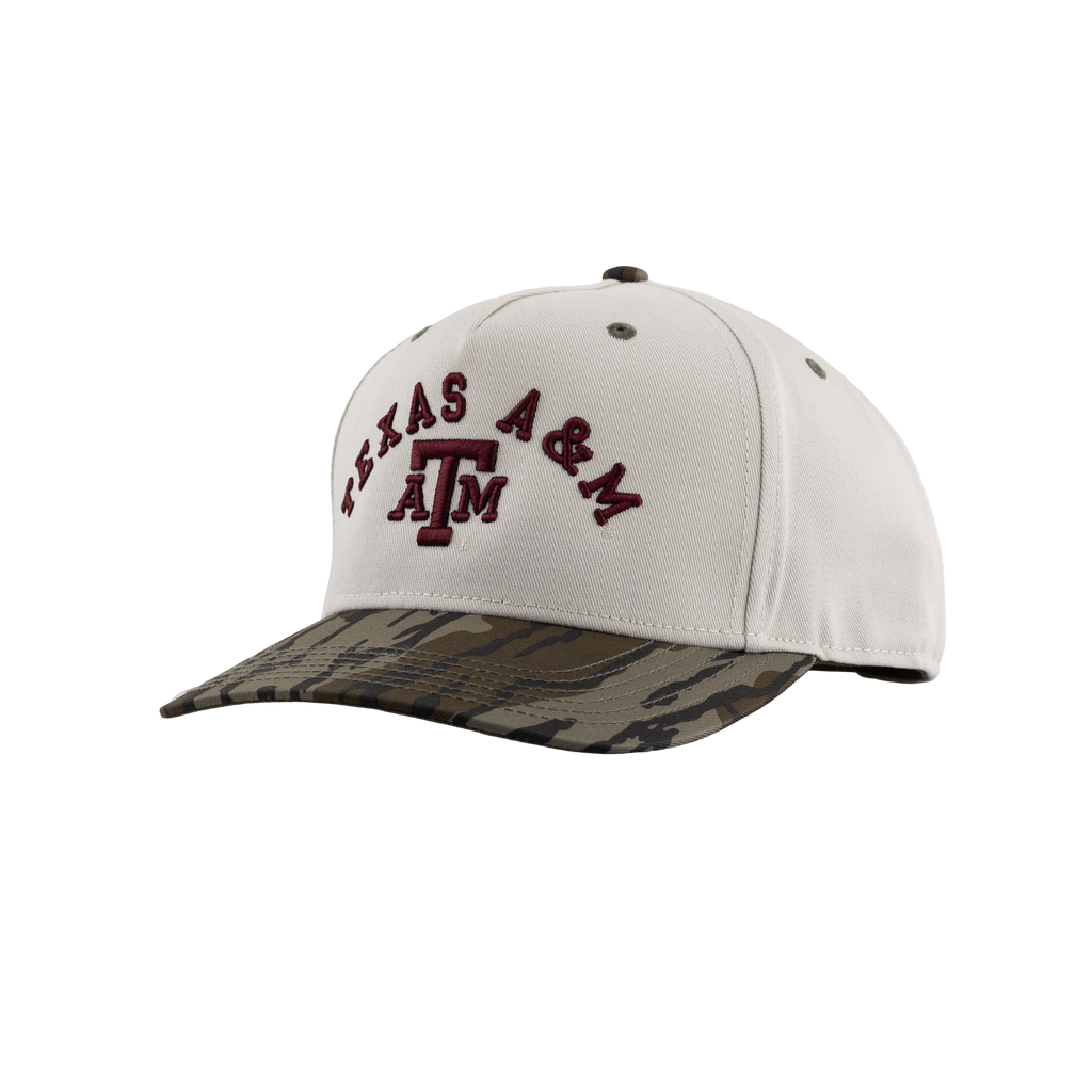 Cream Texas A&M cap featuring a maroon embroidered ATM logo and “TEXAS A&M” lettering with a camouflage print bill.