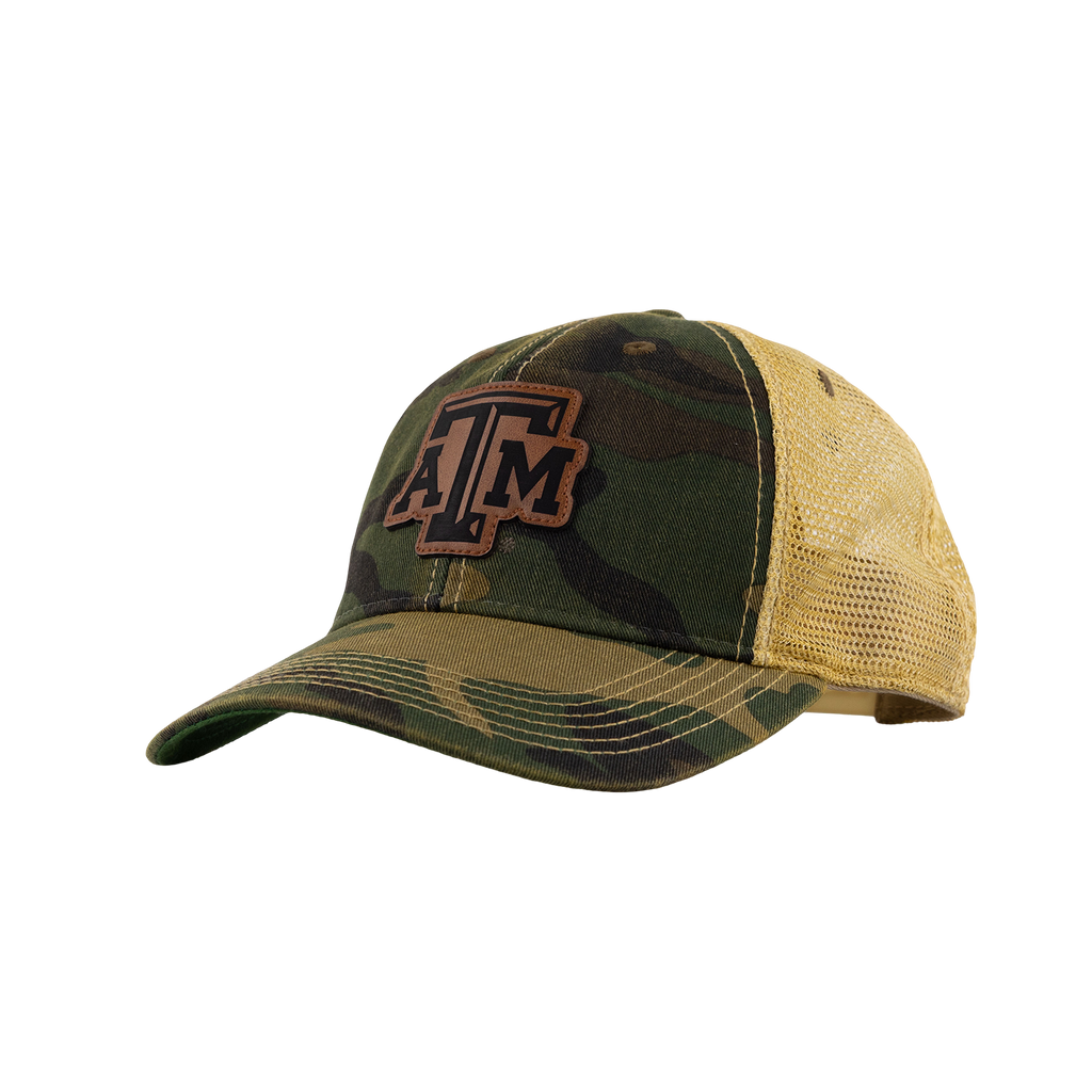 A camouflage trucker hat with a tan mesh back and a brown embroidered 'A&M' logo on the front, shown against a plain white background.