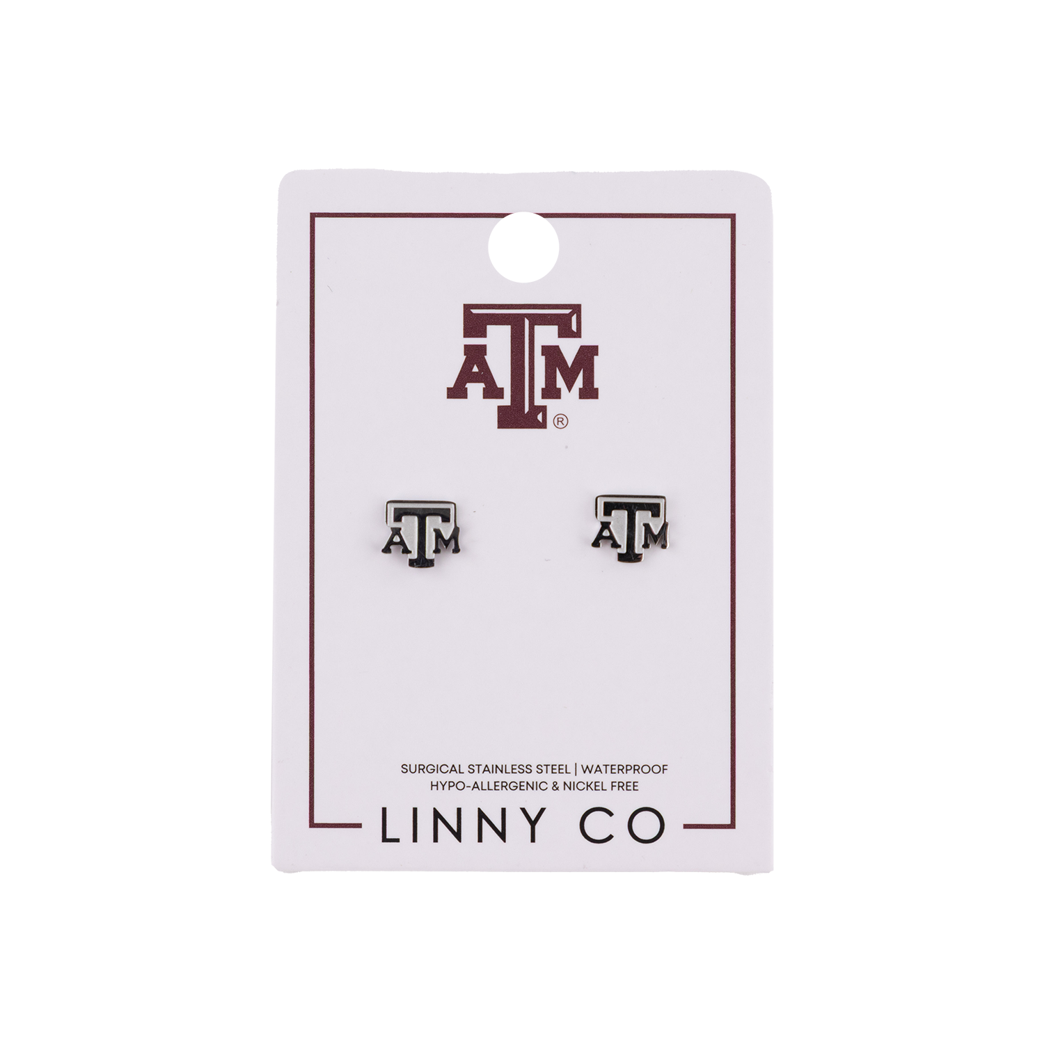 A pair of Texas A&M stud earrings on a white display card. The earrings are silver with a Texas A&M 'A&M' logo.