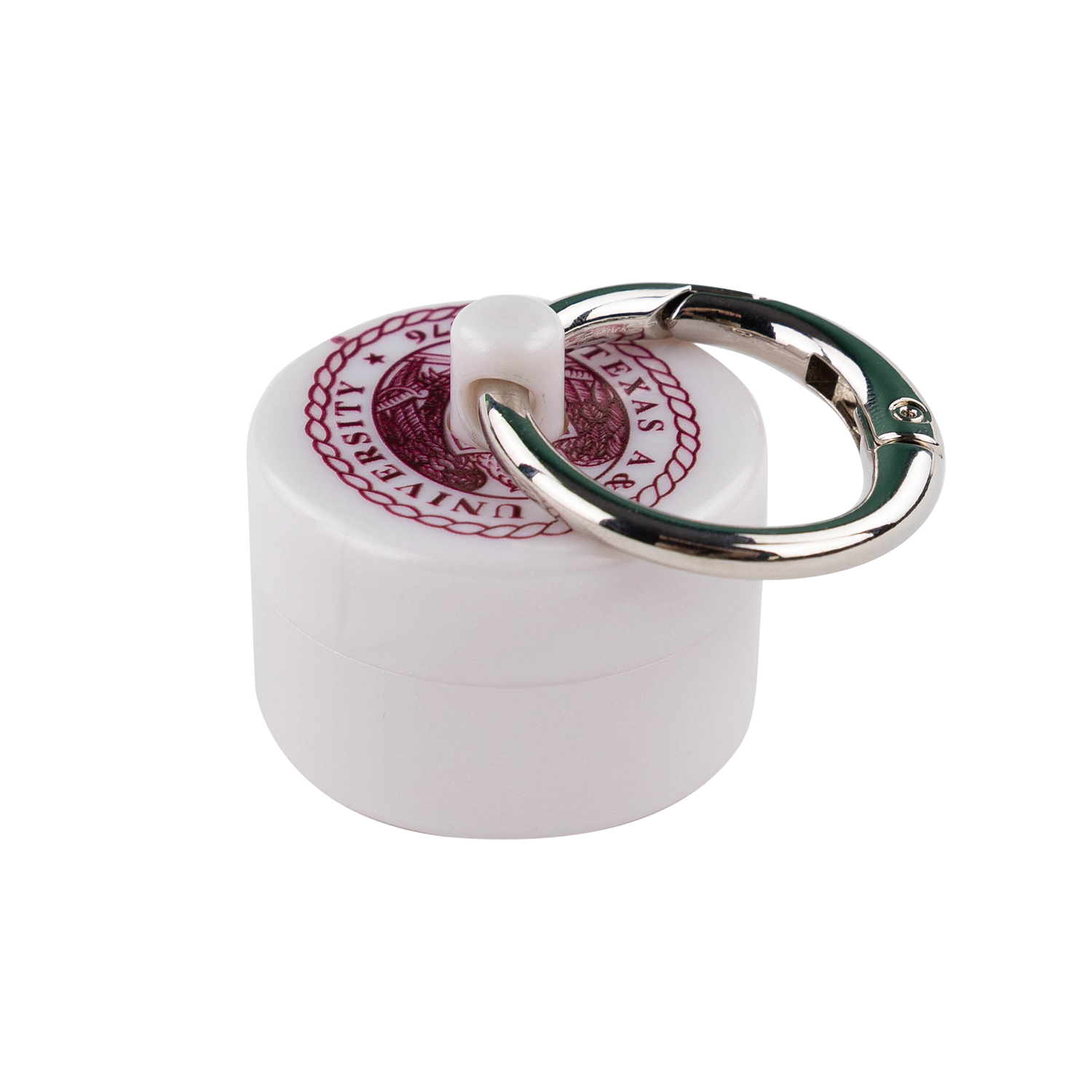 White cylindrical container with a keychain attached  with the Texas A&M Crest in maroon.
