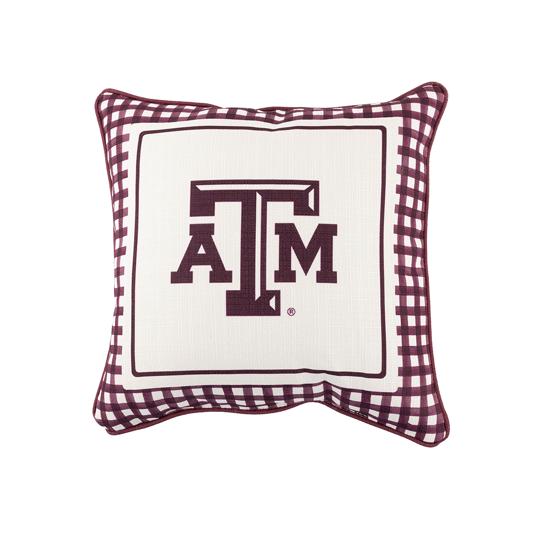A square decorative throw pillow featuring a maroon and white gingham border with a central white panel displaying the maroon Texas A&M 'ATM' logo.