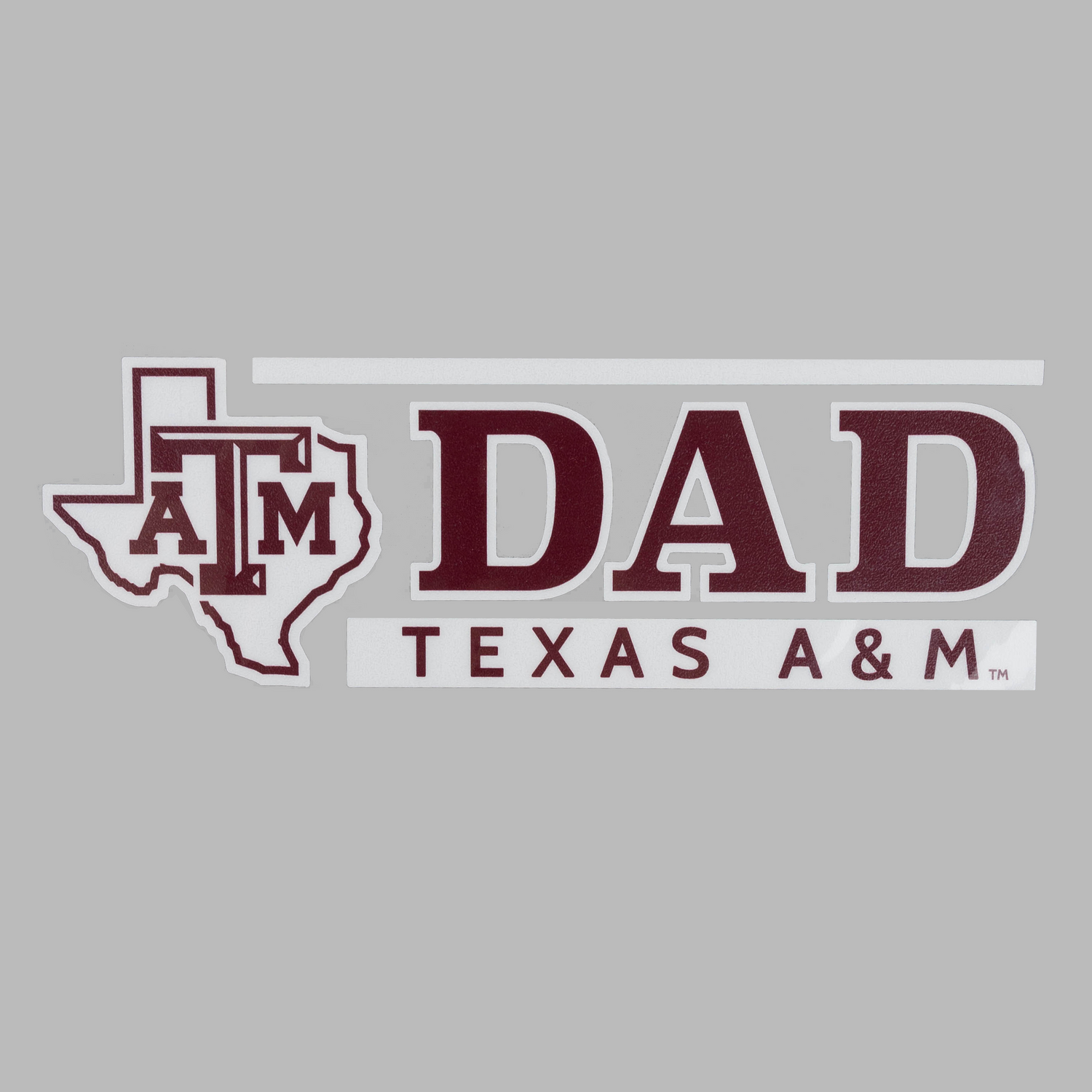 Texas A&M Dad decal featuring a maroon Texas state outline with the ATM logo, next to the word 'DAD' in large maroon letters and 'TEXAS A&M' text below, on a gray background.