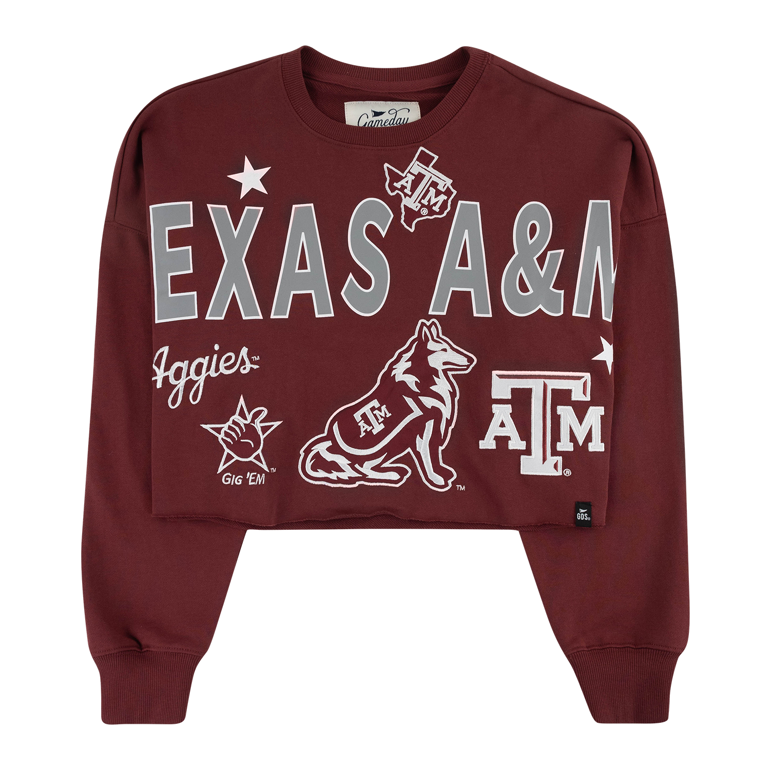 A maroon cropped crewneck sweatshirt featuring Texas A&M Aggies embroidered and printed graphics, including the large 'TEXAS A&M' text, Reveille, and ATM logo, displayed on a clean white background.