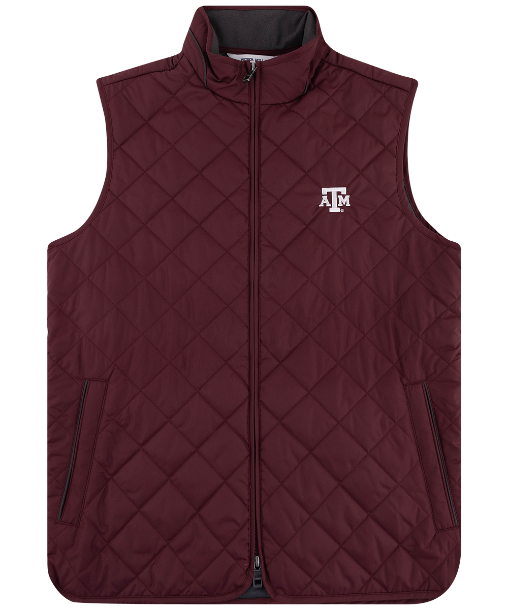 Maroon Peter Millar Texas A&M quilted vest featuring a full-zip front, stand-up collar, white embroidered ATM logo on the chest, and two zippered hand pockets.